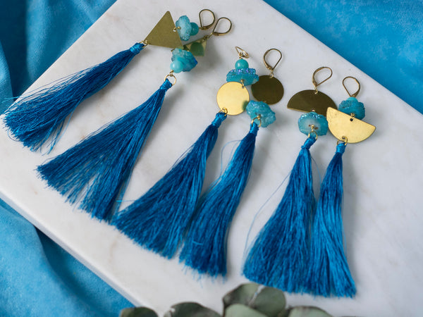 Marici asymmetric blue tassel golden tone brass earrings